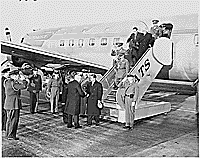 Photograph of President Truman shaking hands with the Shah of Iran upon the Shah's arrival at Washington National Airport., 11/16/1949 - ARC Identifier: 200141.