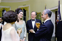 In conversation before State Dinner (foreground, L-R) Lady Bird Johnson (back to camera), Lynda Johnson, V.P. Hubert
Humphrey, Shah Mohammad Reza Pahlavi of Iran, 08/22/1967